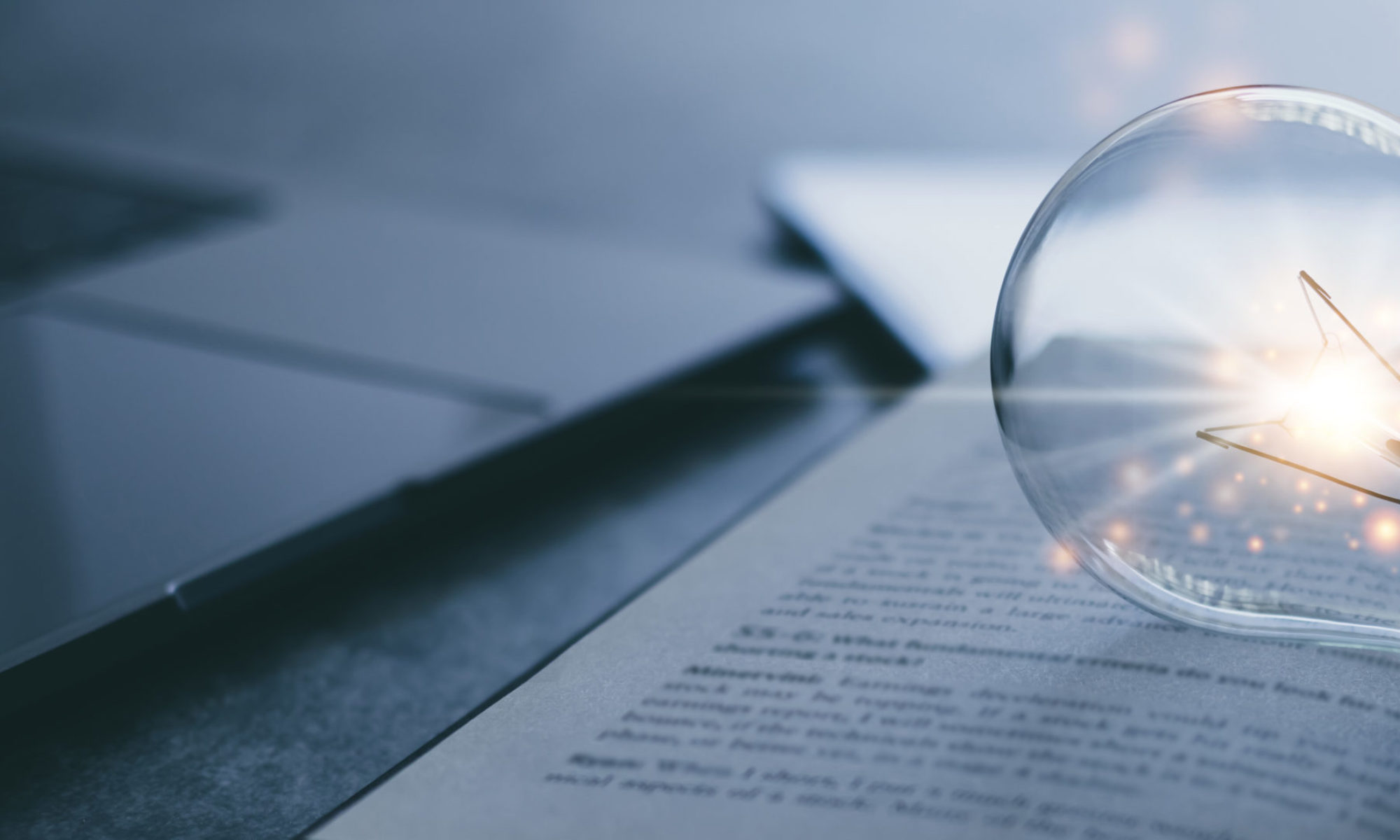 Decorative image of a light bulb on a book